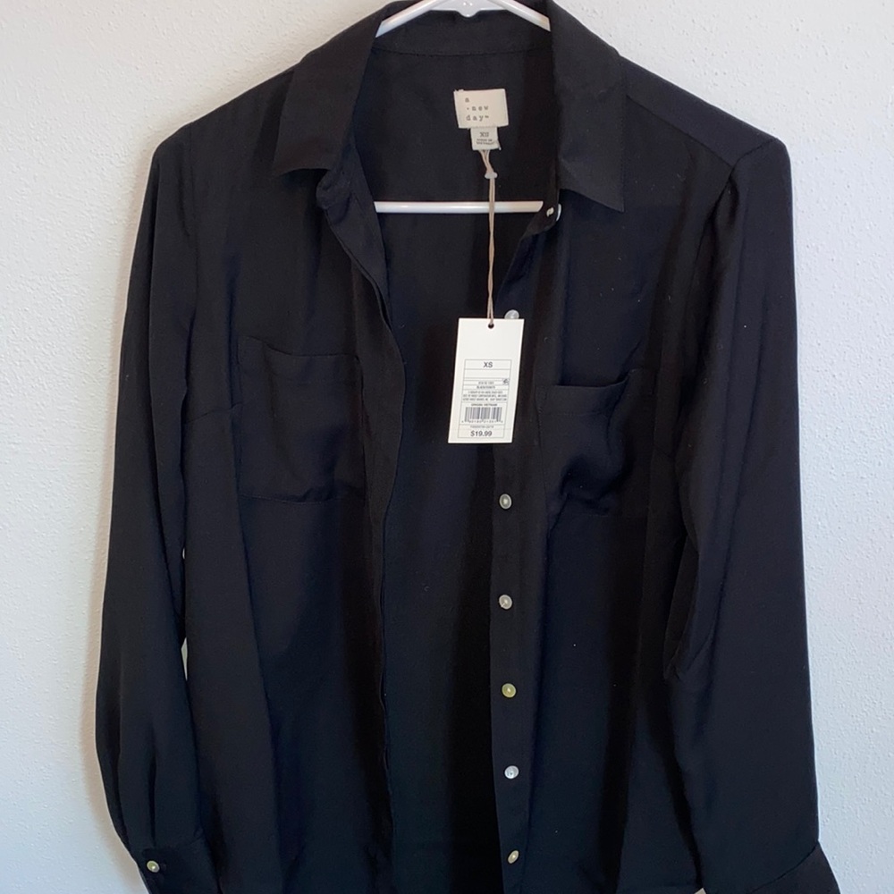 A new day brand new black blouse! Great material. Size XS